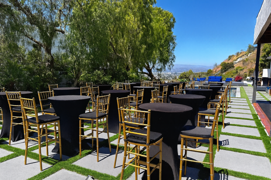 10.08.25 backyard setup cocktail tables cross back natural chair